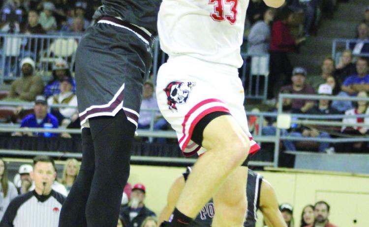 Dale senior Dayton Forsythe goes up for a shot but is blocked by a Pocola player during the Class 2A State Tournament Finals, held at the State Fair Arena on March 9. Teammate Jett Higdon got the rebound. The Pirates are State Champs for the third year in a row. They beat Warner, 87-50; Hennessey, 67-44; and Pocola, 63-38, and they end the season with a record of 30-2. Countywide & Sun/Natasha Dunagan