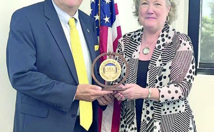 Reynolds Recognized for Service to the Council of Presidents Seminole State College President Lana Reynolds (right) was recognized by the Oklahoma State Regents for Higher Education last week for her service as Chair of the Council of Presidents for 2023-2024. At the June meeting of the COP, Reynolds was presented an engraved wooden medallion marking her tenure as Chair by Vice Chair Dr. Thomas Newsom (left), President of Southeastern Oklahoma State University. Photo provided by SSC