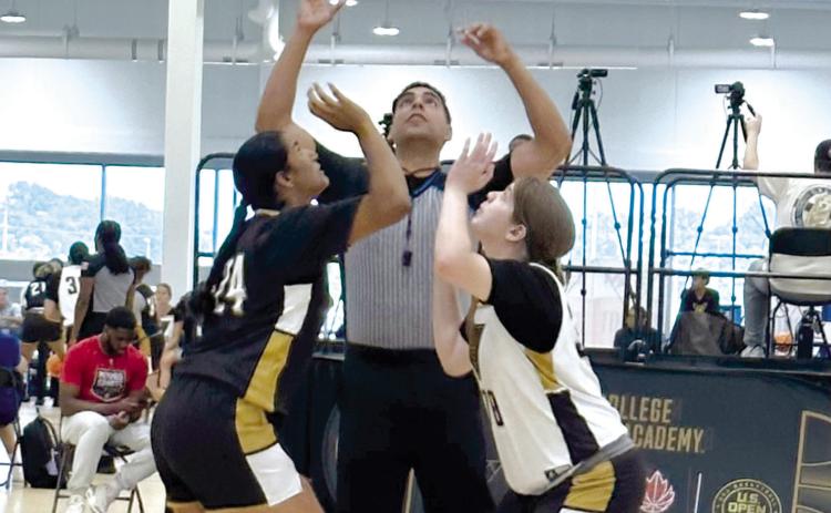 Tecumseh High School senior Reagan Berry, right, tips off during the NCAA Women’s College Basketball Academy in Memphis, TN, last month. Photo provided.
