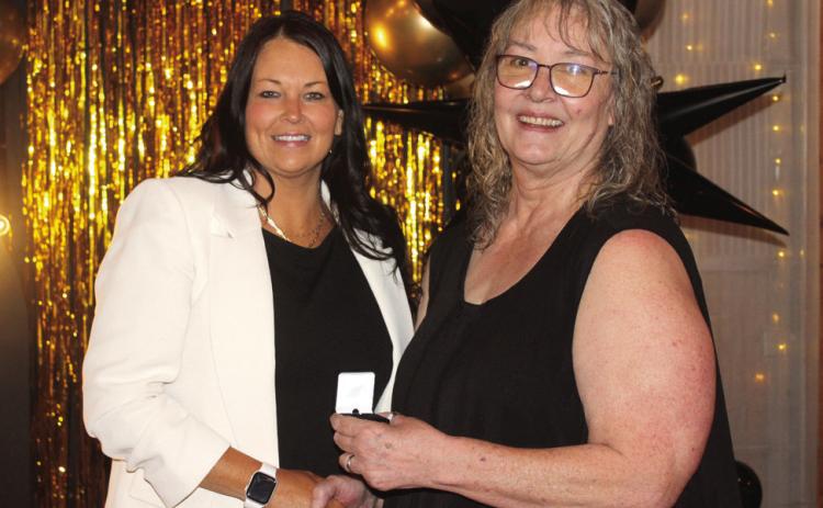 Countywide & Sun Owner and Publisher Suzie Campbell, right, presents a Pottawatomie Power Poll Top 10 lapel pin to Ashley Fichtner during the Awards Gala on Oct. 24. Natasha Dunagan, Countywide &amp; Sun
