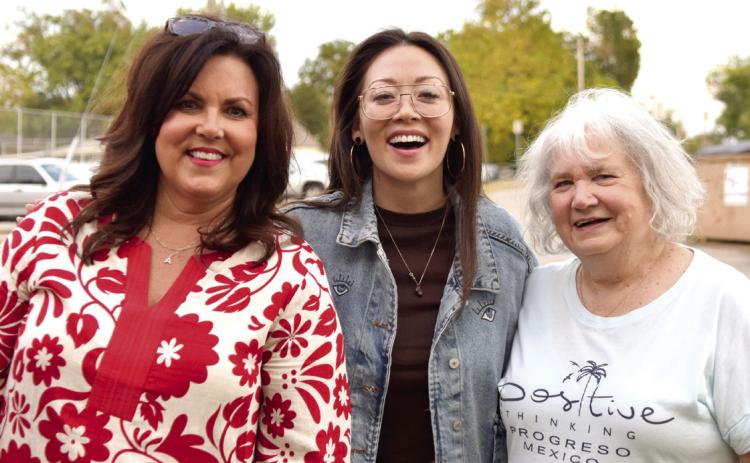 At the Dunbar Heights block party, Fiona Rene poses with her fourth grade teacher, Andrea Brown (left) and reading specialist, Wanda Hadley (right), from when she attended Will Rogers Elementary. Mrs. Brown said, 'Fiona told me back then that she was going to be an actress when she grew up!' Julie Talton, Countywide &amp; Sun