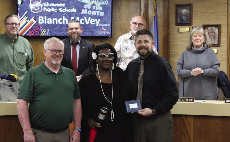 Shawnee Bus Monitor Blanch McVey, center, was chosen as the Shawnee Star of the Month during the Jan. 8 Shawnee Board of Education meeting. Also shown are Transportation Director John Wiles, left, and Superintendent Dr. Aaron Espolt. Behind them are members of the board, Russ Oliver, President Clif Harden, Keith Sandlin and April Stobbe. Countywide & Sun/Natasha Dunagan