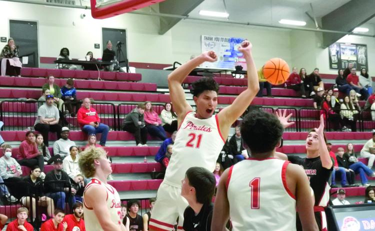 Dale junior Keldan Meely celebrates after a slam dunk during the Class 2A District home game against Luther on Feb 19. The Pirates won, 94-18, advancing to the Regional Tournament hosted by Dale beginning Feb. 24. Cheyanna Dietz, Countywide &amp; Sun Intern