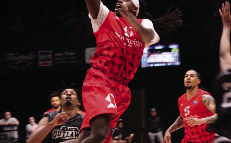 Potawatomi Fire small forward K.D. Moore jumps up to put in a layup and gets the foul during the May 4 home game against the Enid Outlaws. According to www.potawatomifire.com, Moore made 32 points, 10 rebounds, four assists and two blocks that night. In their 15th straight win this season, the Fire beat the Outlaws, 130-107. Countywide & Sun/Natasha Dunagan
