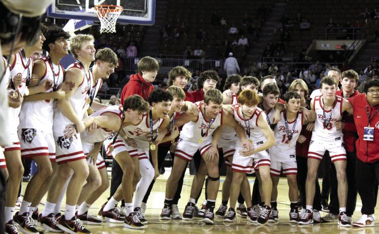 The Dale Pirates Basketball Team prepares to run up and claim the golden basketball trophy after winning the OSSAA Class 2A Basketball State Championship on March 8 at the State Fair Arena. The Pirates won against Cashion on March 6, 74-55; Fairland on March 7, 76-51; and, Pocola on March 8, 60-20, to take state for the fourth year straight. They end the season with a record of 30-2. Read the full story on page B1. Natasha Dunagan, Countywide & Sun
