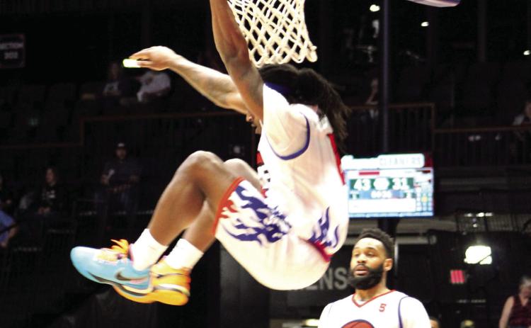 Potawatomi Fire Forward K.D. Moore makes a slam dunk in the second quarter of the home game on April 29. Moore tied with fellow forward Ruston Hayward at 19 points to lead the game, according to potawatomifire.com. The Fire beat the 7’ers, 142-94, for a seven-game winning streak. Countywide &amp; Sun/Natasha Dunagan
