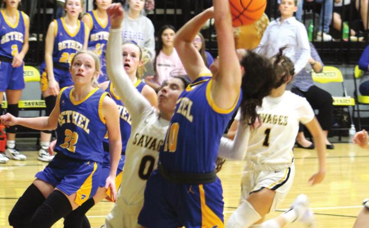 Bethel’s Parker Stevenson (#10) goes in for the shot and draws a foul against Tecumseh’s Jadyn Wilson (#0) during the Tecumseh home game on Dec. 3. Bethel won 71-57. Countywide &amp; Sun/Natasha Dunagan
