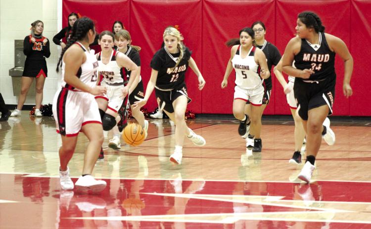 Maud freshman Aubri Kueneman moves the ball down the court during the fourth quarter of the game at Macomb, Nov. 28. The Maud Lady Tigers won, 51-33. Countywide &amp; Sun/Natasha Dunagan