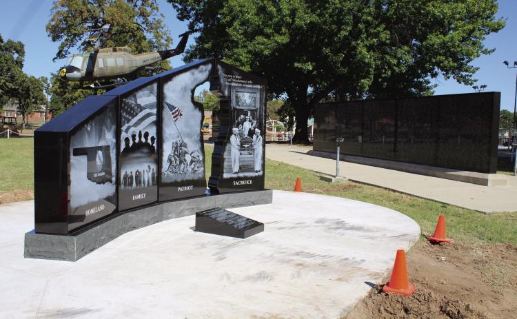 The Gold Star Families Memorial Monument was installed on Oct. 17 at Woodland Veterans Park, in Shawnee, just southwest of the Oklahoma Veterans Memorial Wall, which lists 7,568 names of Oklahomans killed in war. The four panels of the new monument, depicting Homeland, Family, Patriot, and Sacrifice, were designed by the Shawnee Oklahoma Veterans Memorial Committee, and installation was completed by the Woody Williams Foundation.