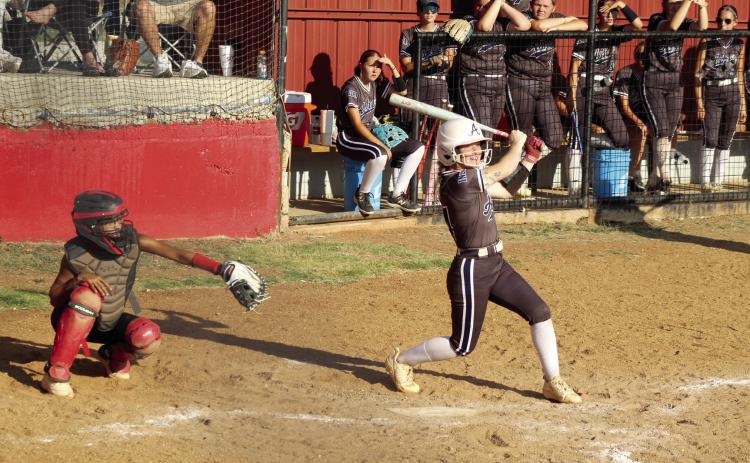 Asher senior Makaylee Harrell decks a double during the Sept. 4 game at Earlsboro. Also shown is Earlsboro catcher, senior Molli Bustos. The Asher Lady Indians won 5-0.