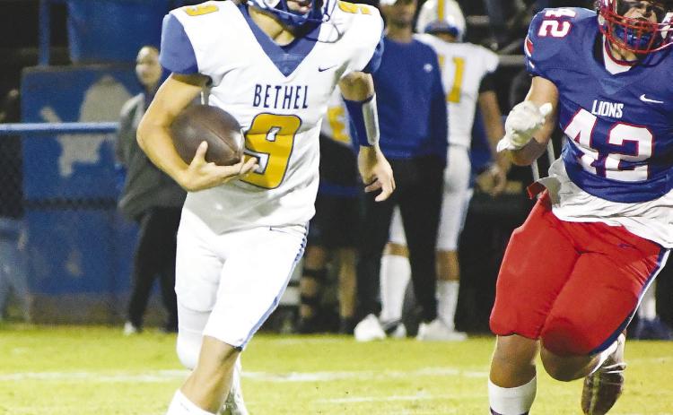 Bethel’s Maddox Davis (9 )tries to elude Chandler’s SamHall (42).