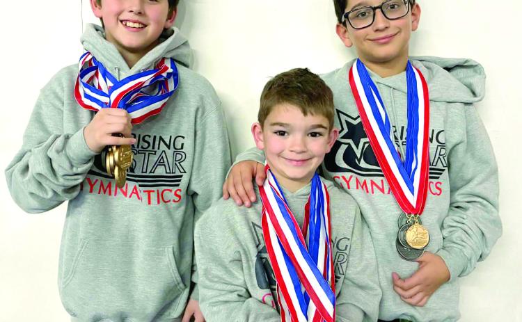 Luke Mailloux, Jackson Bottoms and Otavio Volpe, all from Shawnee, pose with medals they won at the Bart Conner Invitational in Norman on Feb. 8. Photo Provided