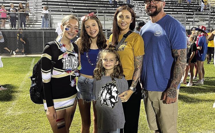 Jacob Warner, also known to his YouTube fans as ‘Puddin,’ enjoys a Tecumseh football game on Sept. 9, 2022 with his three daughters Hailee, Kayley, and Ella and his wife, Ashley. Tecumseh beat the Seminole Chieftains 34-8. Countywide &amp; Sun/Adriana Fincher