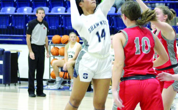 Shawnee freshman Chrishelle Milum tries for a basket but is fouled in the third quarter of the Dec. 15 game against Crossings Christian. Playing back on the newly-repaired Performing Arts and Athletic Center, the Lady Wolves won, 56-34. The Wolves came up short, 47-67. Countywide & Sun/Natasha Dunagan