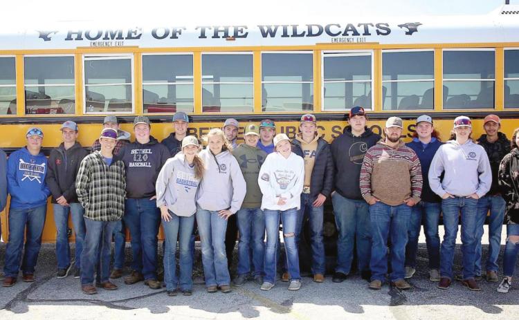Bethel FFA Advisor Brett Scott, far left, and the Bethel FFA Shooting Team members who qualified for the OKSSSP State Competition pose by their bus before leaving for El Reno on April 13. Photo provided.