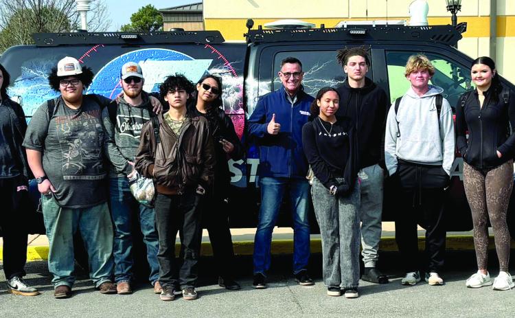 A group of Tecumseh juniors pose with Chase Rutledge and the Storm Chaser from KOCO news during the career fair on March 3. Cheyanna Dietz, THS Intern