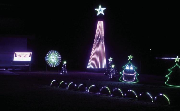 The Pottawatomie County Historical Society Light Show has moved outdoors this year, since they have installed a fence around the Paul and Ann Milburn Center. It features 13 Christmas songs programmed to synchronize with the light show, and it lasts about 26 minutes, said PCHS Director Ken Landry. Countywide & Sun/Natasha Dunagan