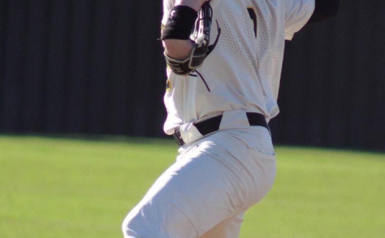 Tecumseh senior Kaiden Pounds winds up for the pitch during the April 4 game with North Rock Creek. The Savages lost, 0-3. Countywide & Sun/Natasha Dunagan