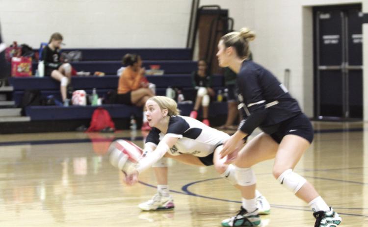 Shawnee senior Kylee Moore makes a save during the Shawnee Volleyball Invitational Silver Bracket game against North Rock Creek, held at Shawnee Middle School on Sept. 20. The Gold Bracket games were played at Shawnee High School. The Lady Wolves won two games and lost three during the two-day tournament. Eight teams, including Tecumseh, participated.