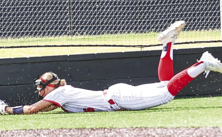 Senior Aspyn Harder makes a diving catch for the out on Aug. 11 when NRC softball took on Cleveland in a district game, winning 16-6, on Aug. 11. Photos courtesy of Gowin Photography
