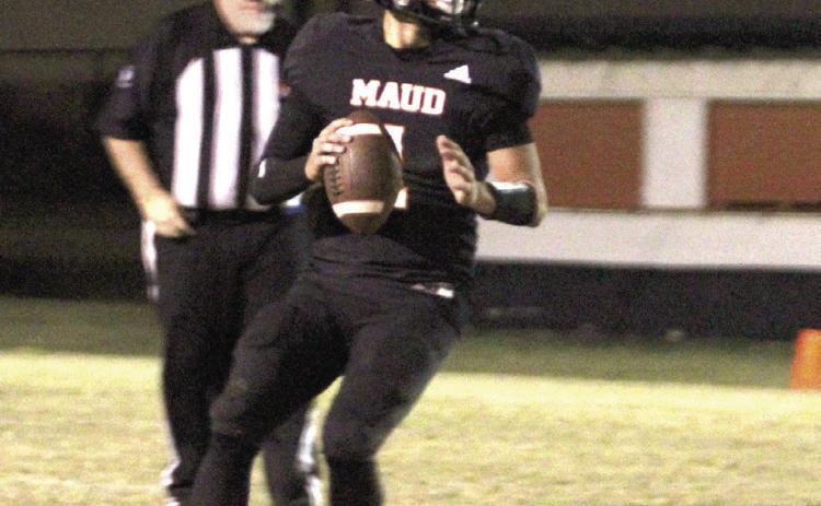 Maud sophomore Trenton Marshall looks to pass before running a quarterback keeper.