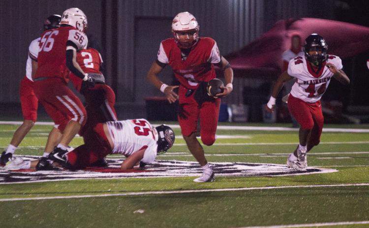 McLoud junior Tucker Mapira makes a 45-yard run on his way to a touchdown during the fourth quarter of the Oct. 15 home game against Plainview. The Redskins lost, 28-51. Photos by Natasha Dunagan, Countywide &amp; Sun
