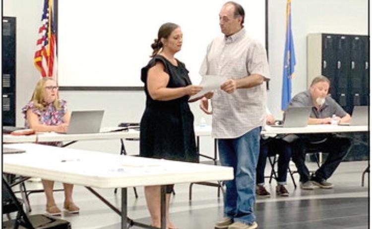 Tecumseh Public Schools Board President Todd Kennedy swears in newly appointed board member Nicole Sanchez. Sanchez will fill Seat 2. Countywide &amp; Sun/Ryan Ackerman