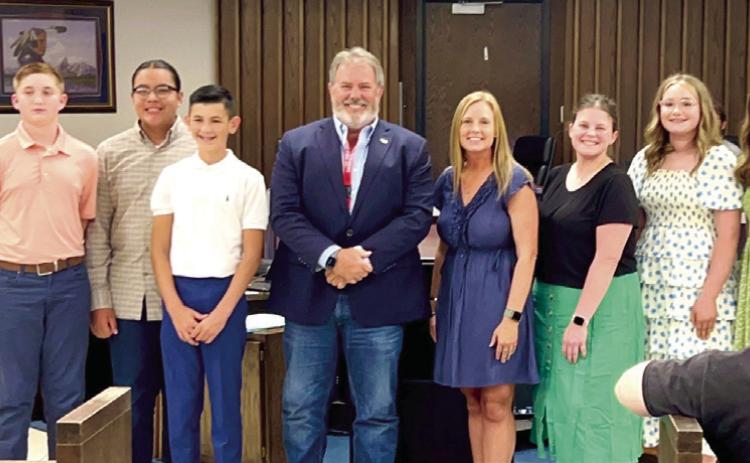 Sister City students recognized at meeting. Pictured with Mayor Eric Stephens (in no particular order) are program chair Jessica Brown, teacher Alanna Baggett, students include Sawyer Bias, Emma Bryan, Chloe Gates, Colin Howard, Matty Newsom, Keiko Sanders, Sullivan Smith, and Benjamin Wahpepah. Photo provided