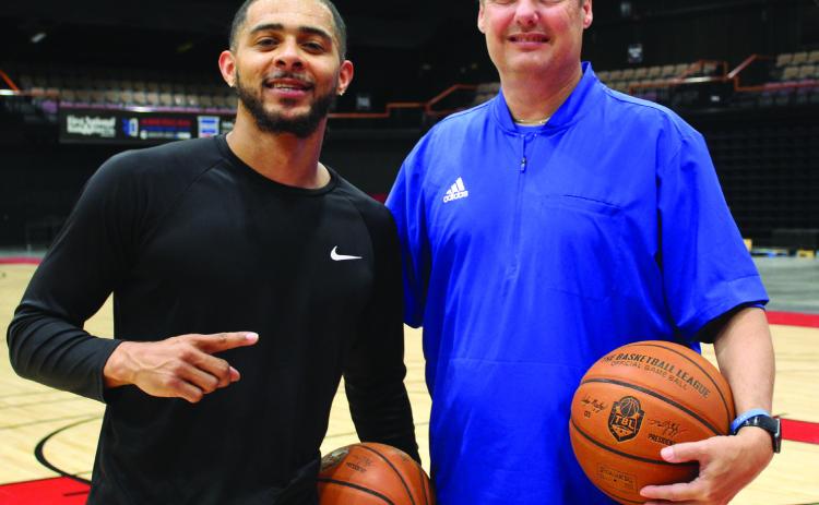New Potawatomi Fire Coach Mark Dannhoff, right, poses at FireLake Arena with one of his players, Tevin Foster, who is returning for their second season. Dannhoff coached the Enid Outlaws last season, and a couple of his former athletes will be joining the Fire, as well. Countywide &amp; Sun/Natasha Dunagan