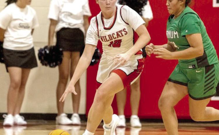 Sophomore Peighton Worley, LRC All Tournament Team skirts past a Varnum defender.
