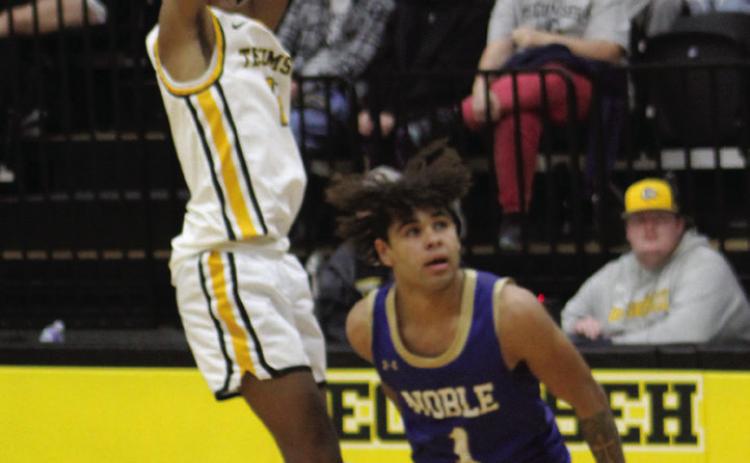 Tecumseh junior Jase Edwards sinks a three-pointer during overtime of the home game against Noble on Jan. 13. Countywide &amp; Sun/Natasha Dunagan