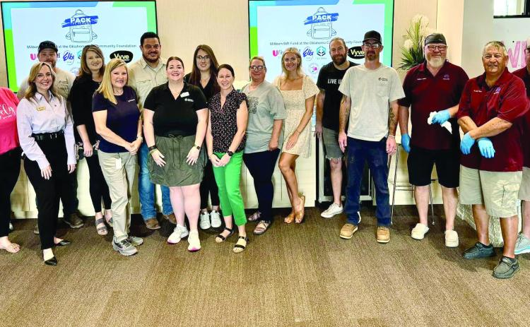 Volunteers from partner organizations serve to make Pack the School a success