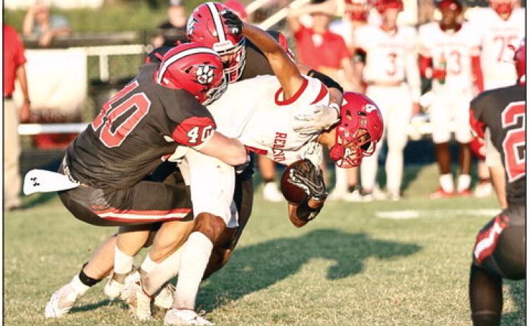 North Rock Creek’s Blain Robison makes the tackle in action Friday night against Prague. NRC lost the game 34-26 making their record this season 1-1. NRC face Holdenville Friday, Sept. 15. Photo courtesy of Gowin Photography.