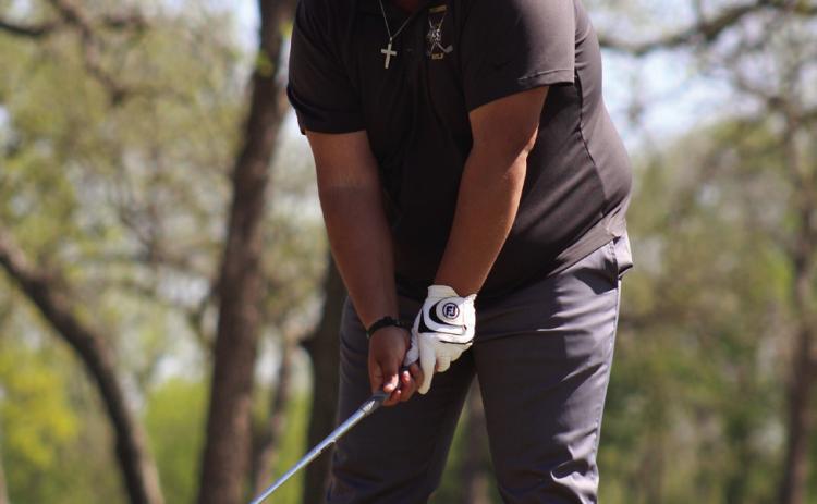 Tecumseh senior Bryscon Cosper prepares to drive toward the 10th hole at FireLake Golf Course during the Tecumseh Boys Golf Tournament on April 11.