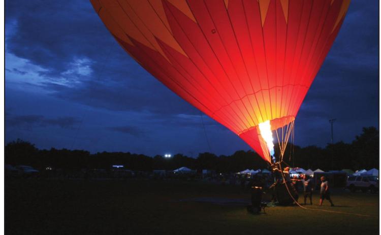 The Arbor MD balloon, piloted by Darrell Duer, lights up the sky. It was one of three balloon teams from Oklahoma City that attended Firelake Fireflight Balloon Fest 2021. Countywide &amp; Sun/Kendra Johnson