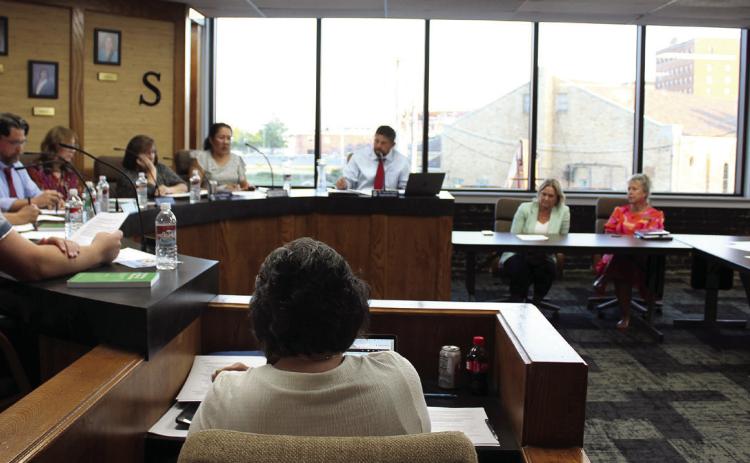 Shawnee Superintendent Dr. Aaron Espolt speaks to the Shawnee Board of Education at the Aug. 5 meeting. The board room was recently remodeled and the windows replaced.