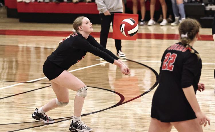 North Rock Creek’s Ryleigh Lay with a dig in regional action last week. Photo courtesy of Gowin Photography