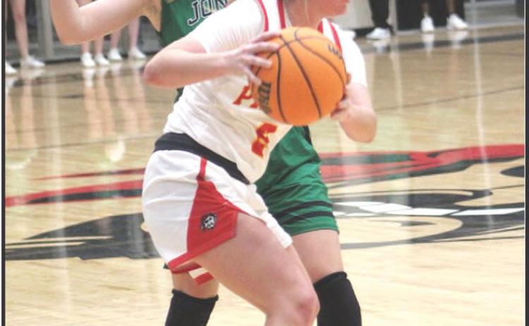 Dale’s McKenzy Herman looks to pass in the home game against Jones on Jan. 3. The Lady Pirates won, 53-37, and the Pirates won their game, 71-52.