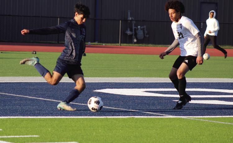 Shawnee’s Ivan Macias makes a corner kick during the April 2 game with Victory Christian. The Shawnee soccer teams were the first athletes to play on the new turf at Jim Thorpe Stadium. The Wolves lost, 0-1 in overtime, and the Lady Wolves lost, 0-6. Countywide & Sun/Natasha Dunagan