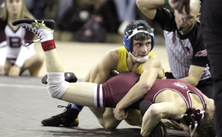 Bethel sophomore Paxton Shultz tries to flip his opponent in the 120 weight division of the OSSAA Class 3A Boys Wrestling State Championship on Mar. 1 at the State Fair Arena. Shultz placed second in the state. Natasha Dunagan, Countywide & Sun