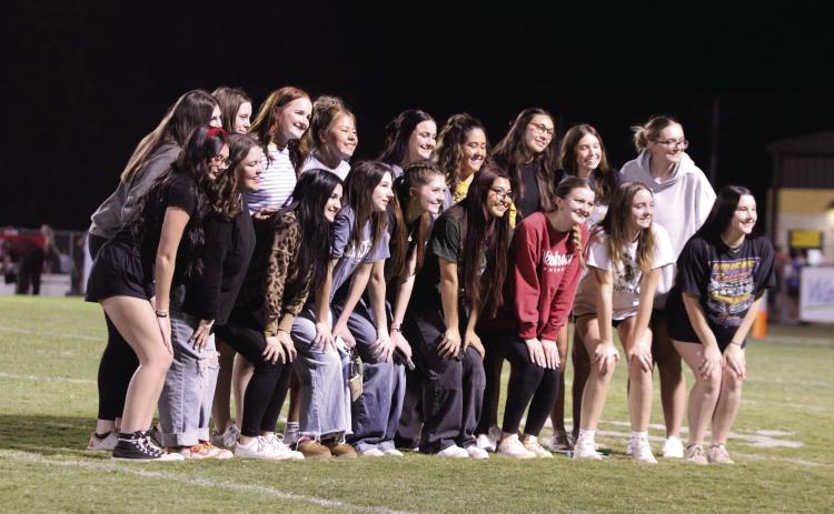 The Tecumseh High School Volleyball Team poses during halftime of the home football game on Oct. 10. The Lady Savages hosted the Class 4A Regional Volleyball Tournament that same day and won over Seminole, 3-0 (25-11, 25-14, 25-11), and against Catoosa, 3-0 (25-14, 25-21, 25-23). They will compete against Community Christian in the state competition today (Oct. 17) at Sapulpa High School at 2:45 pm. Countywide &amp; Sun/Natasha Dunagan