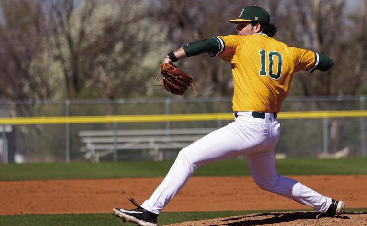 Oklahoma Baptist University’s Nolan Feazle winds up for the pitch in action against Northwestern. The senior pitcher finished the first of a double header with seven strikeouts and got seven fly-ball outs as well. Photot provided by OBU