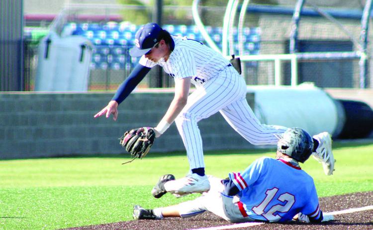 Shawnee freshman Tal Leone leaps over a player from Tulsa Memorial as he slides into third base. The Wolves won both games in the double header, 10-1 and 26-1. Natasha Dunagan, Countywide & Sun