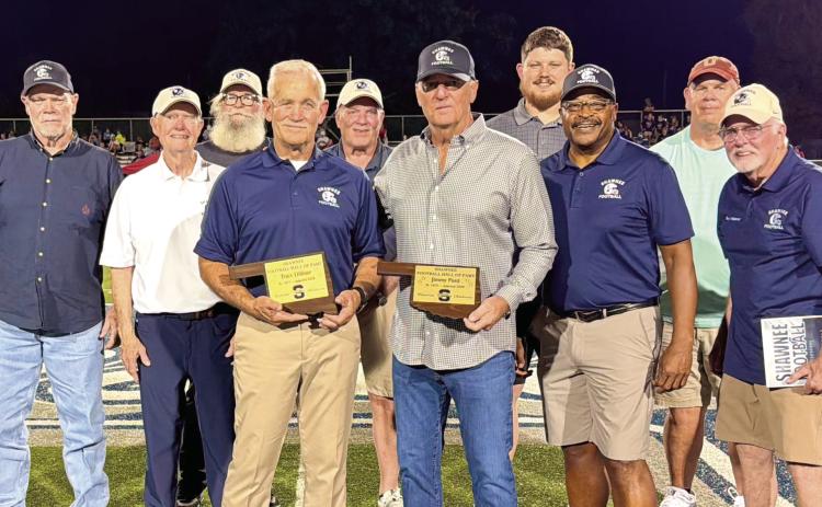 Shawnee Wolves alumni recognize new Hall of Fame Members, Tracy Dilliner and Jim Ford, both from the SHS Class of 1978, on the football field at halftime on Sept. 11. Shown, from left, are Bill Ford, Mike Hawkins, Dennis Brooks, Mike Sperry, Greg Petree, Dilliner, Chris Reynolds, J. Ford, Tristan Wyatt, Timmy Young, Gary Williamson and Kelly Parsons. Photo provided by Shawnee Public Schools