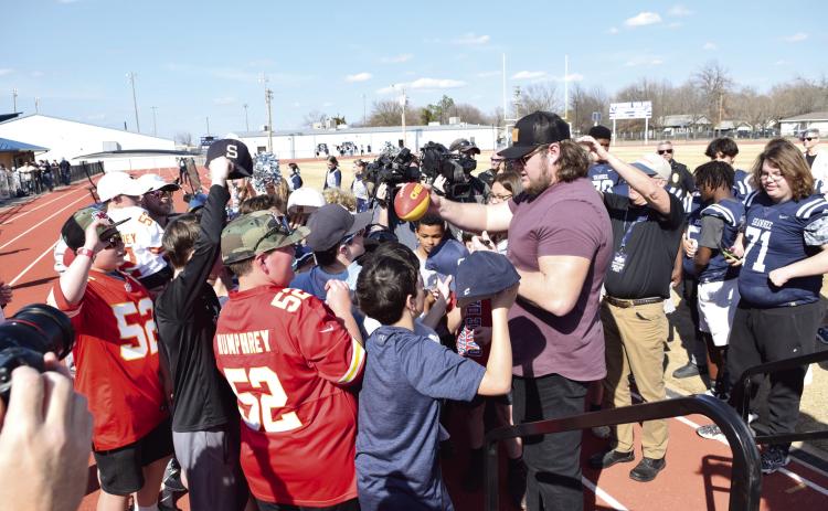 Kansas City Chiefs Center Creed Humphrey signs autographs following the celebration in his honor at Shawnee High School on March 4. Countywide & Sun/Julie Talton