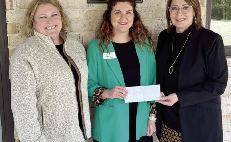 Kathy Laster, Ph.D. President &amp; CEO Avedis Foundation (right) and Tracy Meeuwsen, Program Director Avedis Foundation (left) present a check for a $12,000 grant to Amber Shelton, Regional Director Junior Achievement of Oklahoma. Photo provided