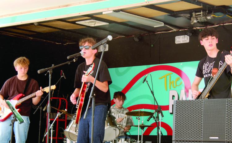 The Shawnee band "Midway" performs on the Pottawatomie County Free Fair Entertainment Stage on Sept. 12. Midway is comprised of Gavin Scarborough on rhythm guitar, Ashton Starkey on lead vocals and electric guitar, Matthias Meek on drums and Daniel Galloway on bass guitar.  See full caption below.