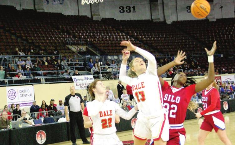 Dale’s Makenzie Gill (#13) and Silo’s Tiani Ellison (#32) battle for possession during the opening round of the Class 2A State Tournament. Dale won the game 67-55, advancing to face Pocola in the semifinals, where they lost 62-63 in overtime, Friday. Countywide & Sun/Kendra Johnson