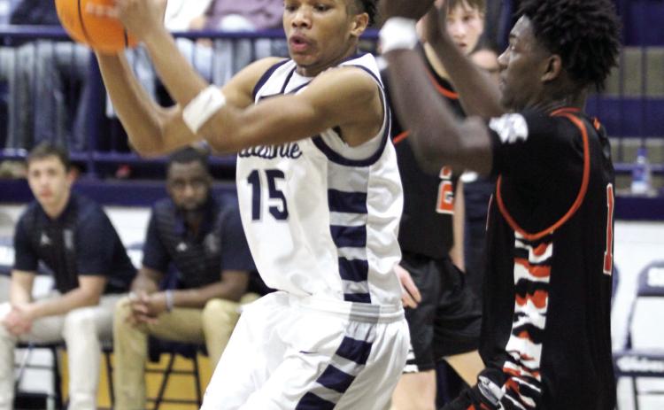 Shawnee sophomore Rah’Mel Slaughter gets ready to make a bucket in the Jan. 7 home game with Booker T. Washington. The Wolves lost, 48-66, and the Lady Wolves also fell, 40-43.