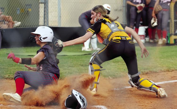 Tecumseh catcher, junior Jaylie Anderson, tags a Prague runner as she slides into home. Natasha Dunagan, Countywide &amp; Sun